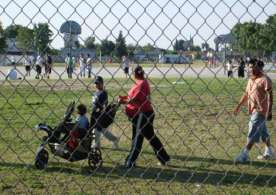 Local residents use the Earlimart Middle School field to walk during after school hours. Source: Susan Elizabeth)