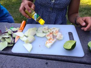 Trying new ways to eat kohlrabi with lime and spices. (Photo source: Farmer to Family Blog)