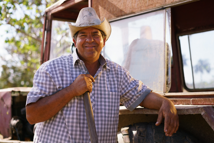 Latino farmer smiling happy