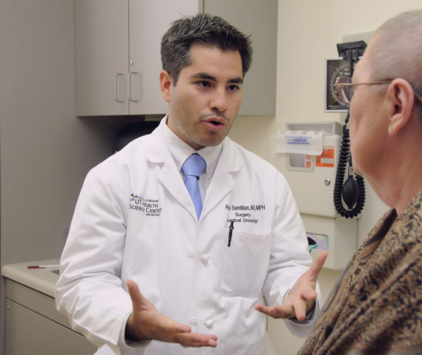 latino doctor with patient