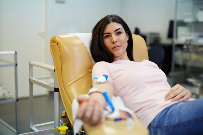 latina blood donor gives blood