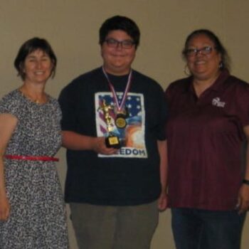 Sierra Middle School 7th Grade Winner for the Best Healthy Eating Film Award in the 2016 Film Fest. Student stands with Barbara Berger to his right and his mother to his left. (Photo Source: Barbara Berger).
