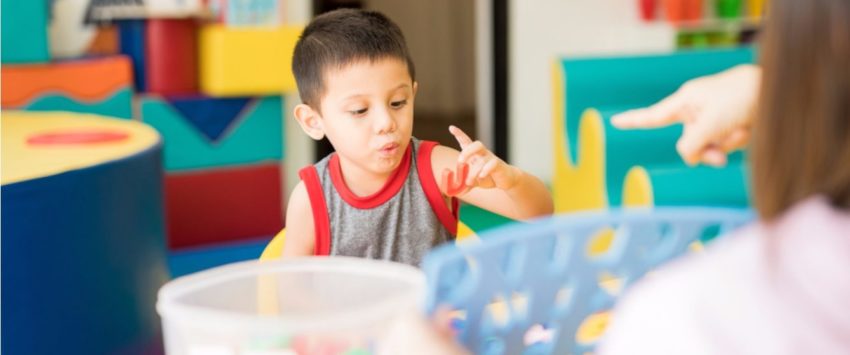 latino boy learning in early education setting