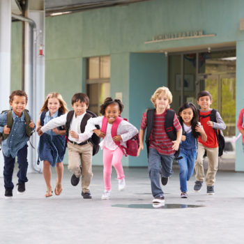 diverse school students running diversity