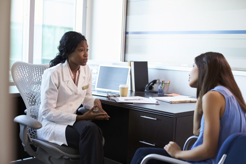 latina doctor patient women reprodcutive health consult talk