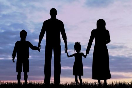 Silhouette of a refugees family with children immigrant