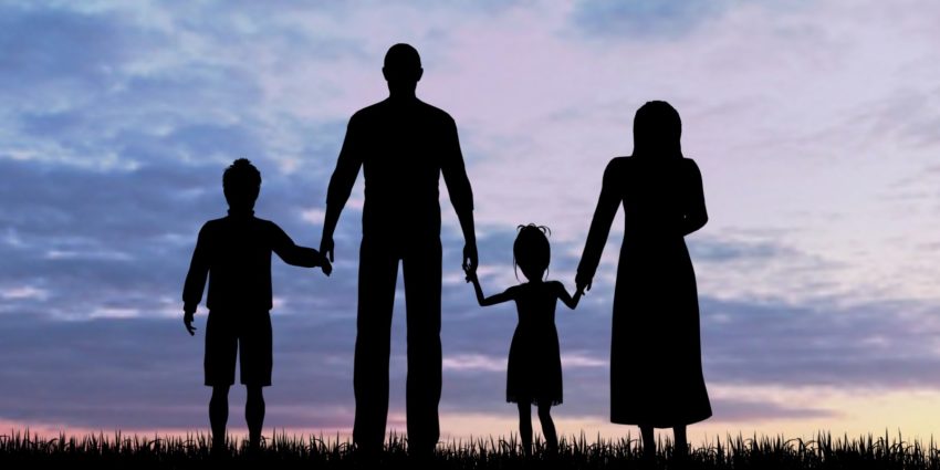 Silhouette of a refugees family with children immigrant