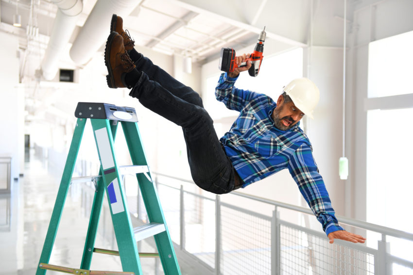 latino man contruction worker falling off ladder