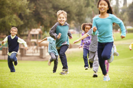 kids running park green space play
