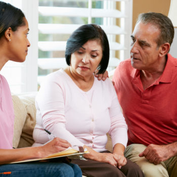 nurse with hispanic latino older couple diabetes pancreatic cancer patient coronavirus covid-19
