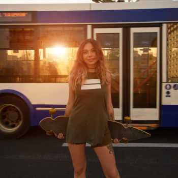 Skateboarding and taking the bus.