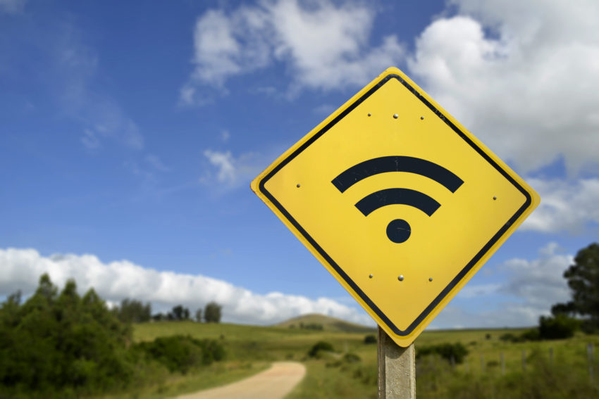 Wifi access road sign concept in rural area Internet broadband