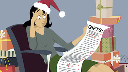 Exhausted woman in a Santa hat sitting with a long shopping list