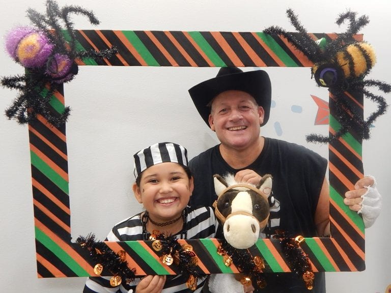 Dave Davis celebrating Halloween at the Children's Museum with a former Head Start student (via cmee.org)
