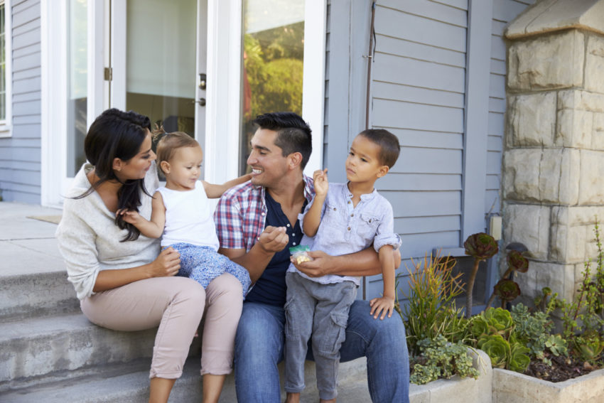 Latino Hispanic family in new affordable housing