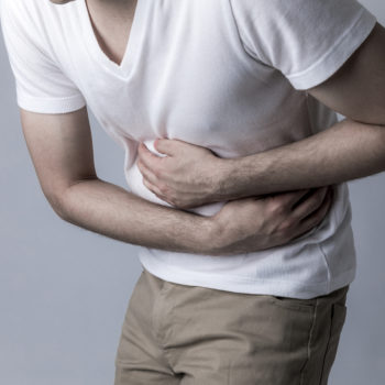 young man having a stomachache gastric cancer