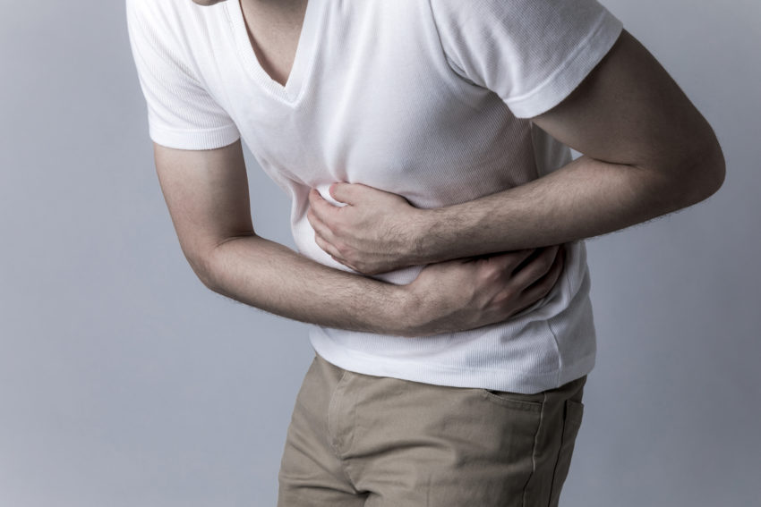 young man having a stomachache gastric cancer