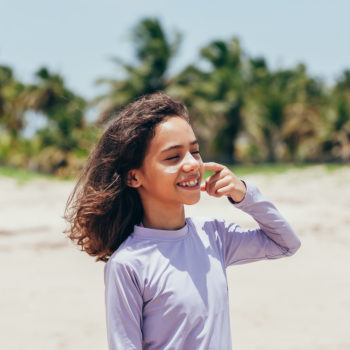 sunscreen apply to prevent skin cancer latino hispanic girl