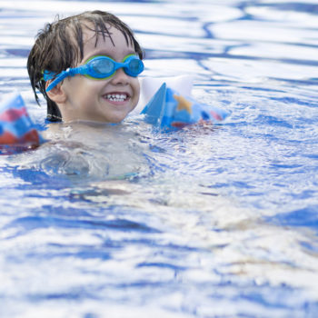 kids swimming in the pool sunscreen