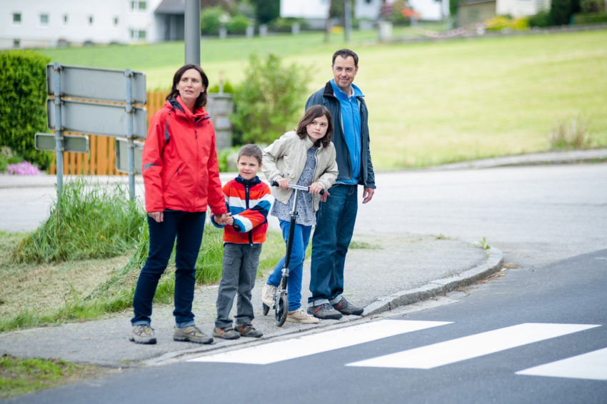 Family will passing the Crosswalk