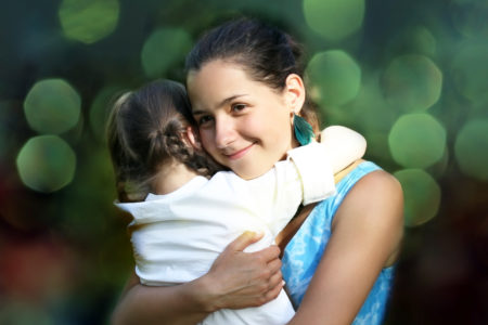 Hispanic heritage month celebrate Latina Latino mom daughter hug