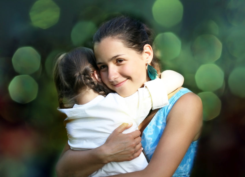 Hispanic heritage month celebrate Latina Latino mom daughter hug