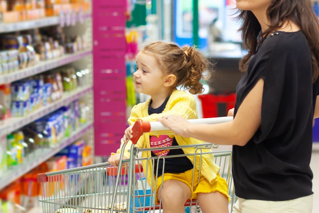 child and mom grocery store food sugary drink shopping