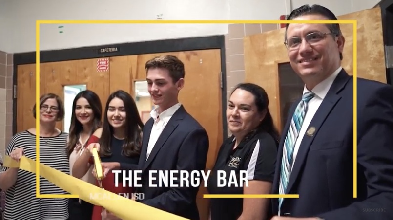 Samantha Almaraz and Pablo Ramirez cut the ribbon for the grand opening of the Energy Bar, their school food pantry in McAllen, Texas.