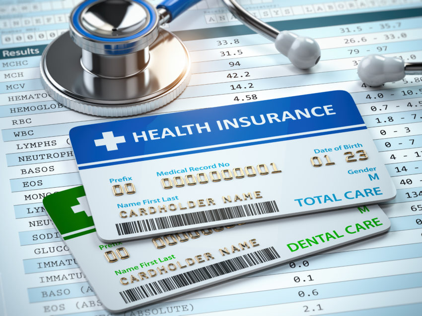Health care Insurance cards total and dental care with stethscope.