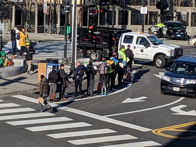 Cambridge Bicycle Safety protesting for a protected bike lane in Porter Square in August 2019