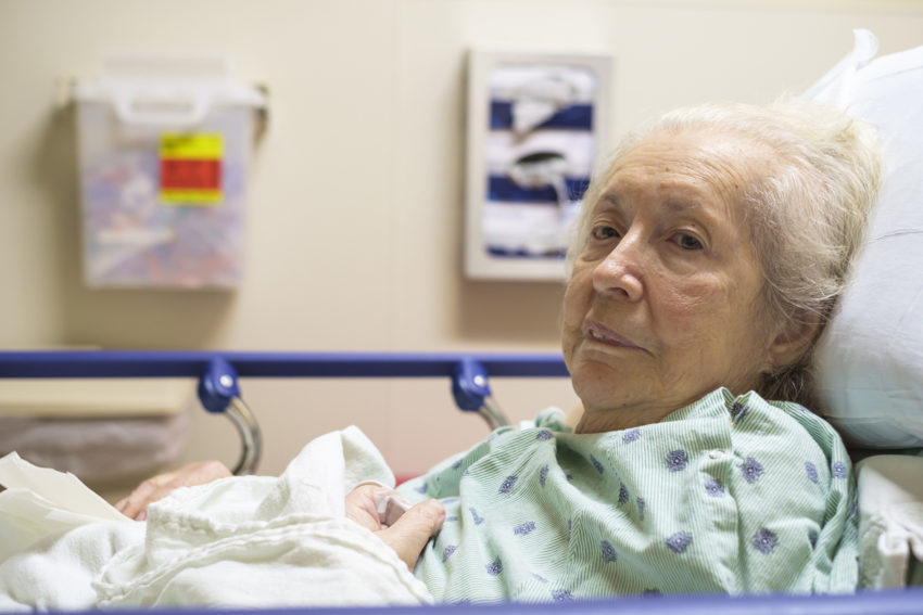 Elderly woman with diabetes coronavirus in hospital bed sick