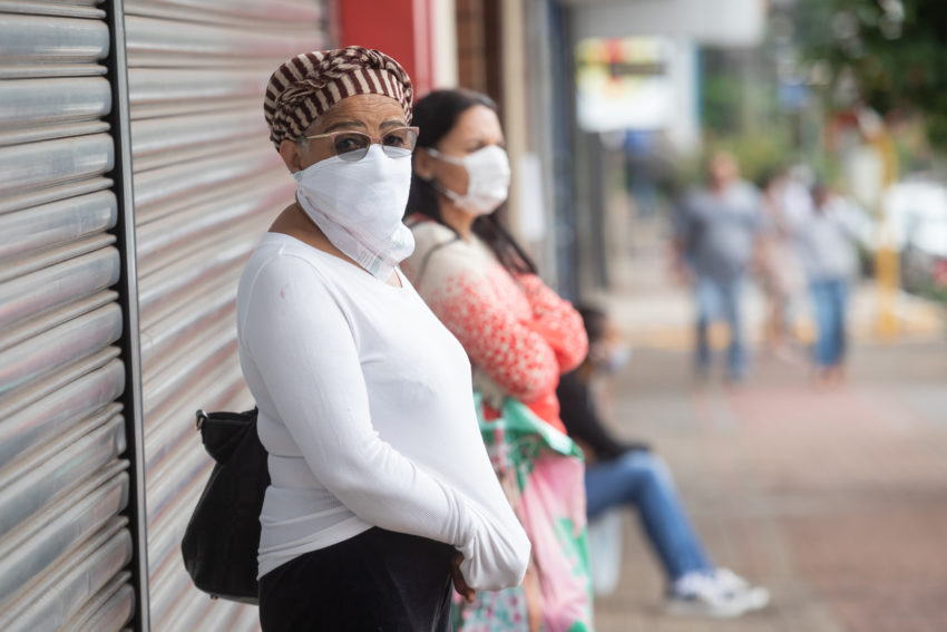 latina woman with face mask to prevent coronavirus covid-19