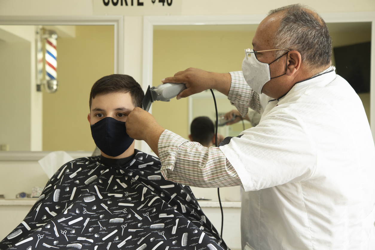 latino boy hair cut face mask due to covid-19 coronavirus