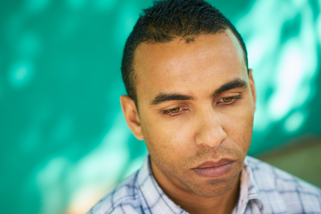 Latino man sad depressed discrimination cohesive culture research review