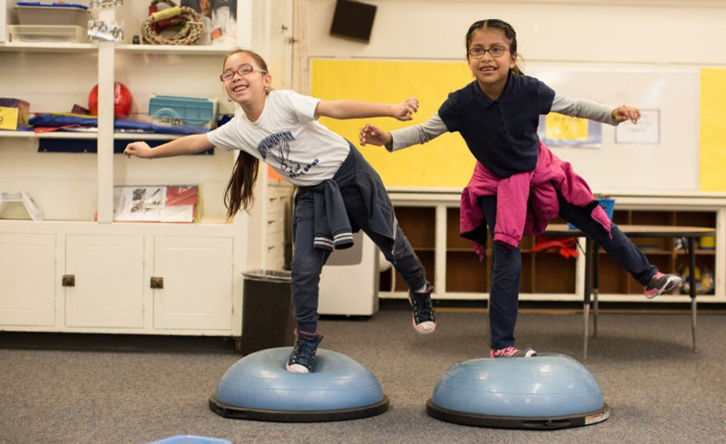 two girls in class school physical activity to fight obesity