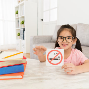 smokefree multifamily housing child with no smoking sign for smoke-free multifamily housing