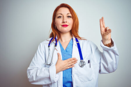 young female doctor swearing medical school oath