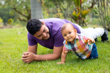Latino father with child.