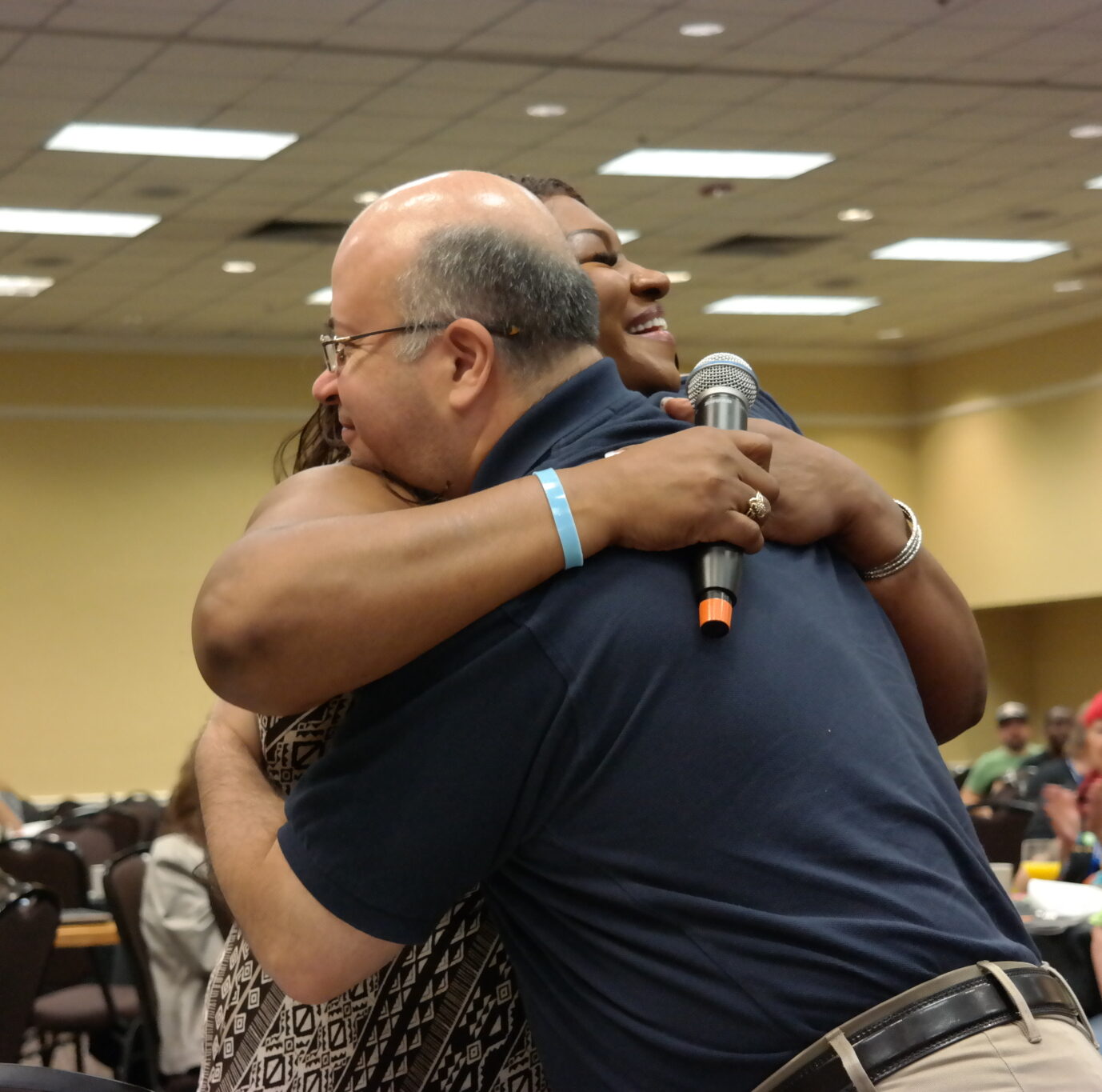 Dr. Martinez embraces an attendee at a Hogg Foundation conference.