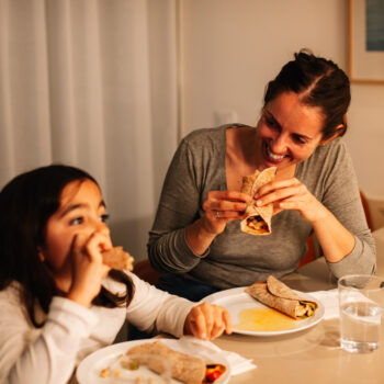 Mom and daughter eating