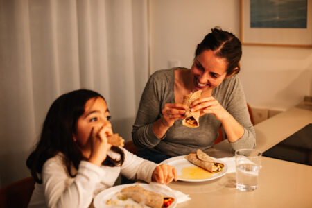 Mom and daughter eating