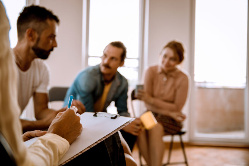 Group of Multiethnic Millennial People talking about their addiction