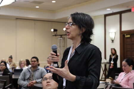 Laura Fejerman asking questions at the 2024 Advancing the Science of Cancer in Latinos conference