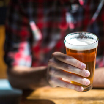 Man holds beer