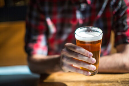 Man holds beer