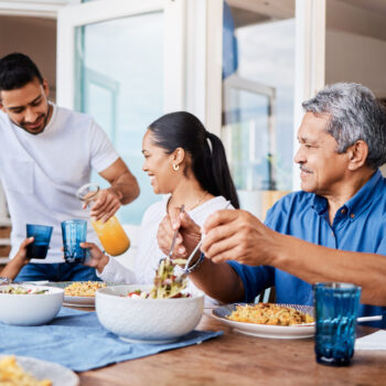 Shot of a happy family having lunch together at home