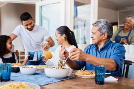 Shot of a happy family having lunch together at home