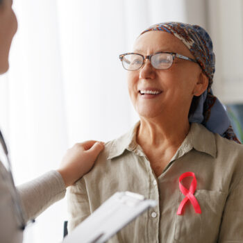 Female patient listening to doctor in medical office.