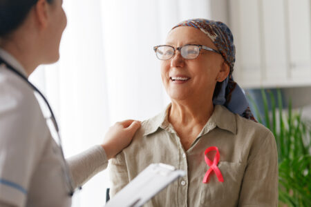 Female patient listening to doctor in medical office.