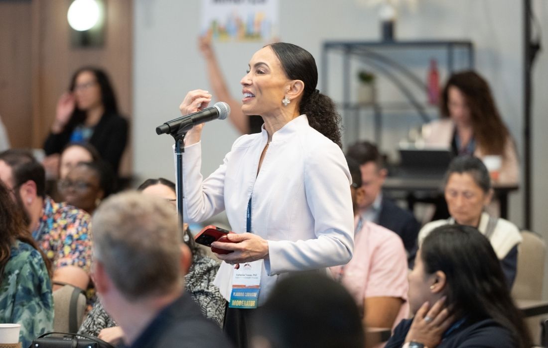 Dr. Katherine Tossas asks a questions during the 2026 Advancing Cancer Research for Latinos and All Populations Conference.
